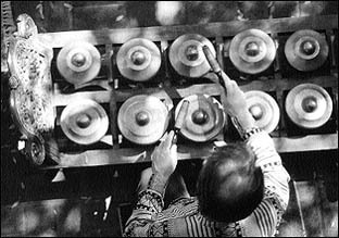 Photo: Man playing the gamelan