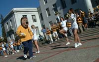 Oski and cheerleaders do a victory dance