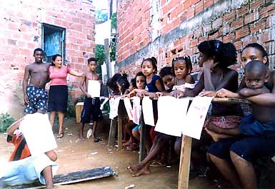 Children and teacher at destroyed school