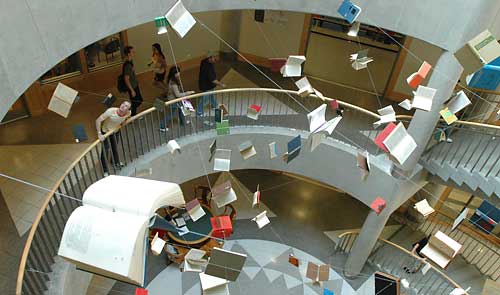 Books appear to fly in the library atrium