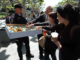 Police officer distributes cupcakes
