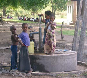 Kids at a village water pump