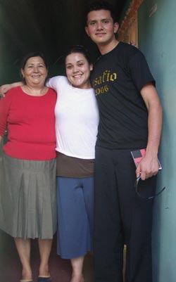  Angela with her brother and mother.