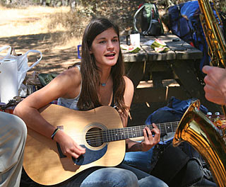 Nicole Campbell playing guitar