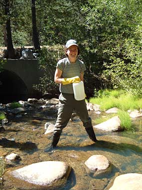 former grad student Helen Poynton collects water samples
