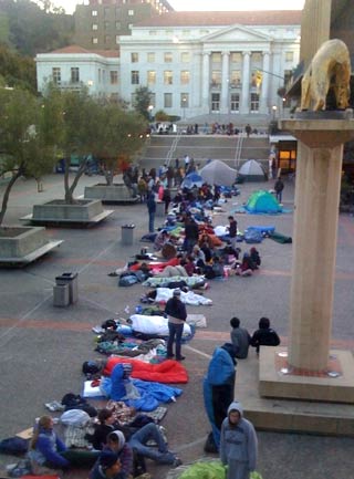Students in sleeping bags and tents line up for Dalai Lama tickets
