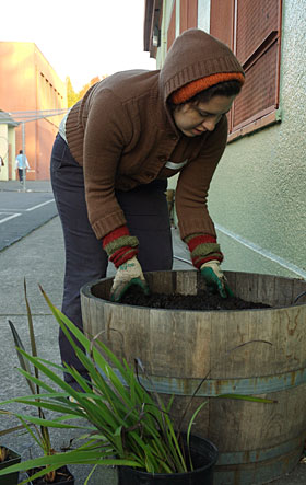 Nadia Alquuaadoomi prepares to plant California native species