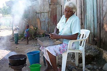 Woman roasting peanuts