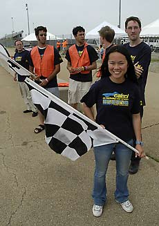 Pit crew awaits the car